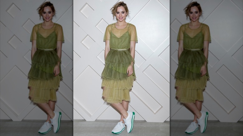 Suki Waterhouse posing with her legs crossed at the the Burberry Beauty Box Event in Seoul in 2014