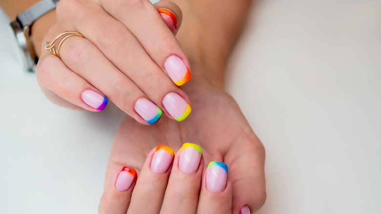 Rainbow french tip manicure 