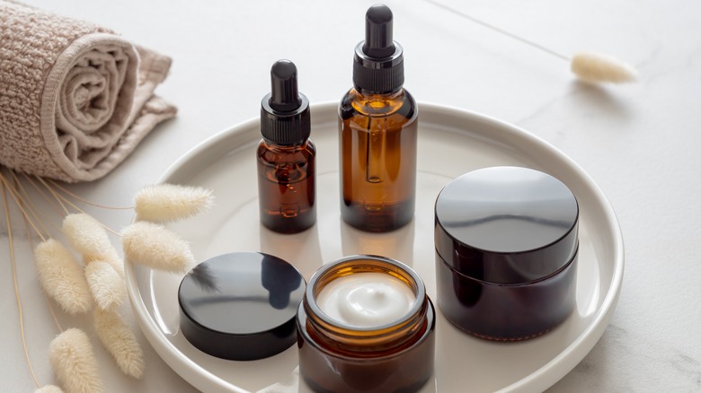 Set of various skincare products including serums and creams