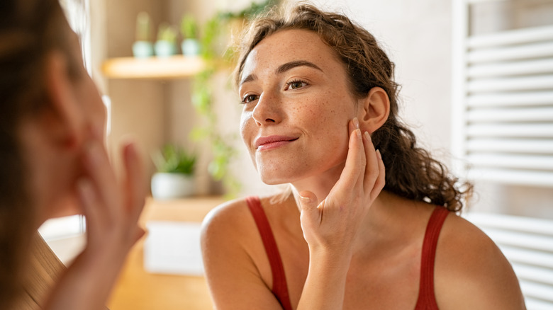 Woman looking at skin