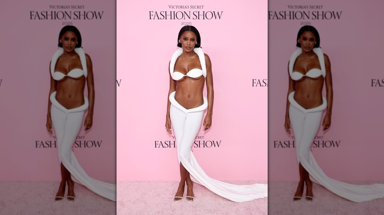 Ciara Miller poses in a padded white two-piece