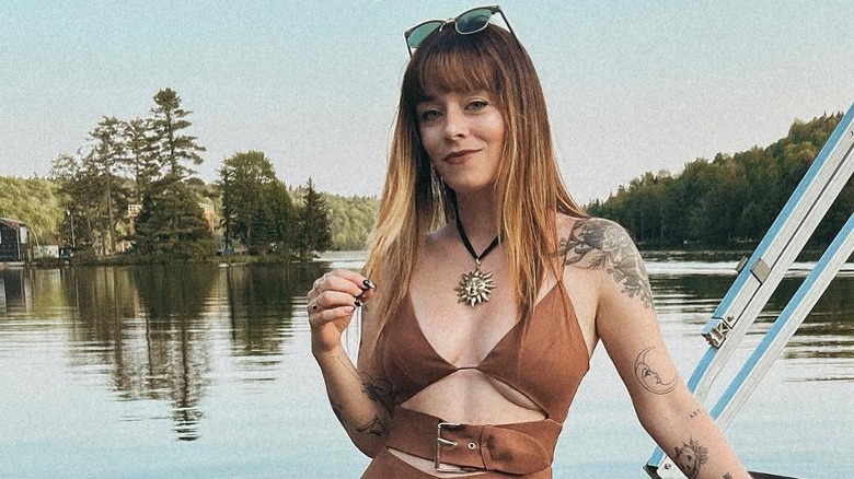 Woman wearing rope sun necklace