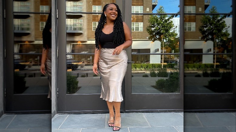 Woman smiling in silk skirt