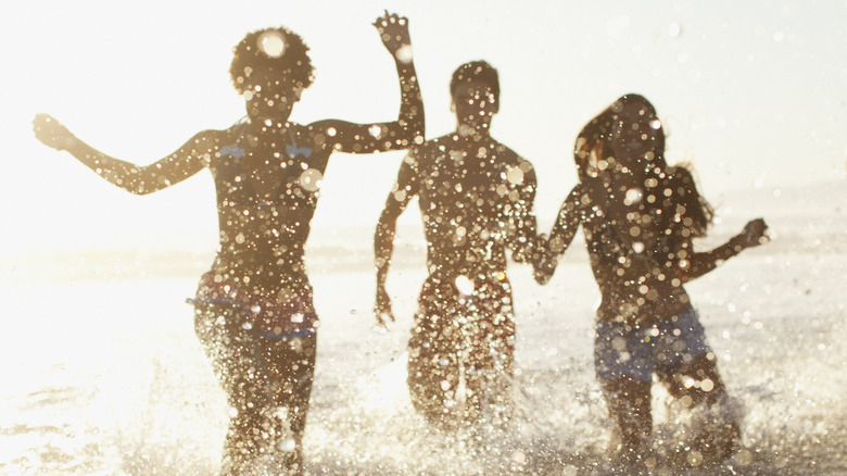 women enjoy the beach