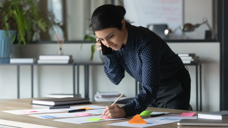 Woman writing down tasks