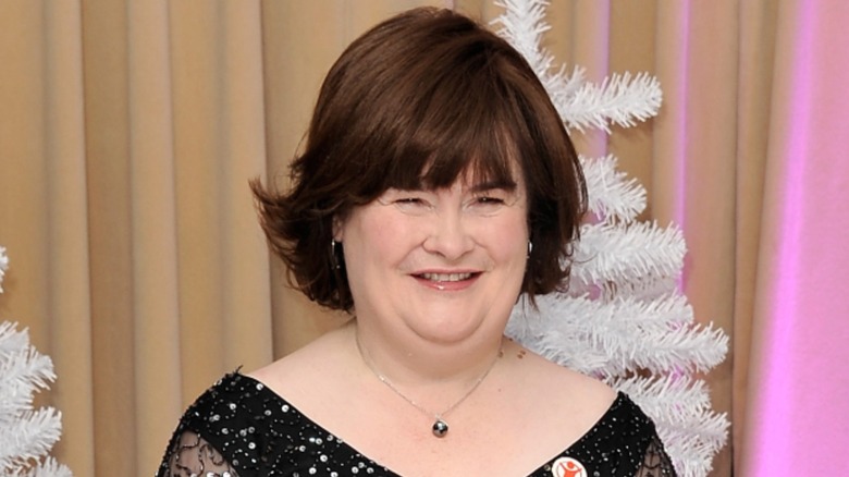 Susan Boyle smiling with a short brunette bob at event in 2013
