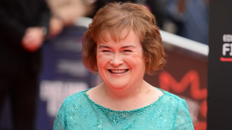 Susan Boyle smiling while wearing a turquoise dress at the England Is Mine premiere in 2017