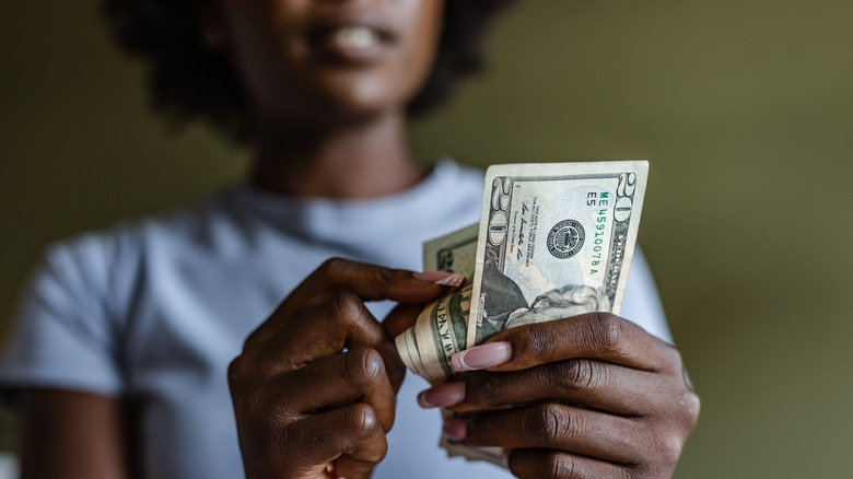 woman counting cash