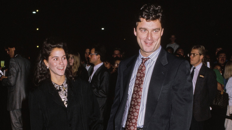 Tony Ressler and Jami Gertz smiling at a movie premiere in 1989
