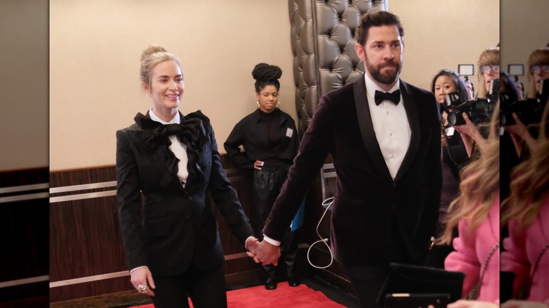 Emily Blunt and John Krasinski wearing matching suits at the Writers Guild Awards in 2019