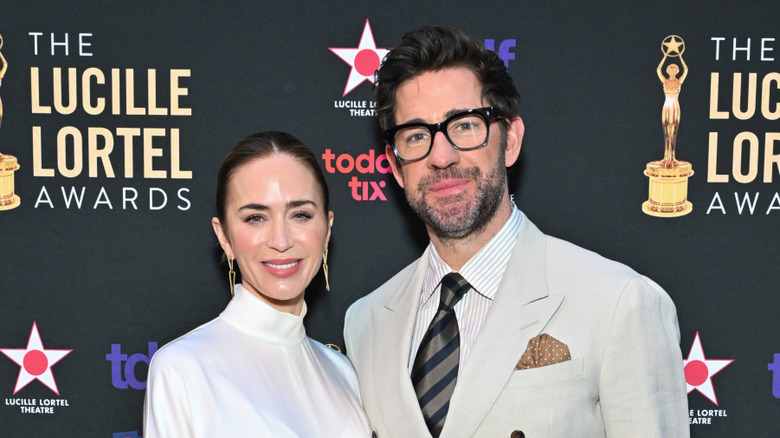 Emily Blunt and John Krasinski posing together on a red carpet