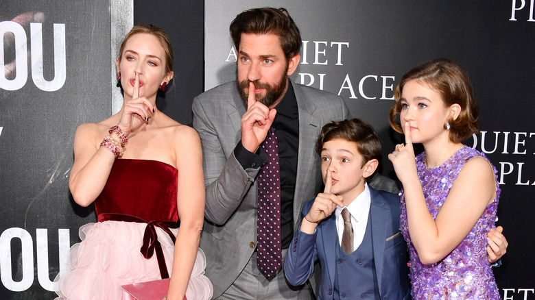 Emily Blunt and John Krasinski pose with co-stars of "A Quiet Place"