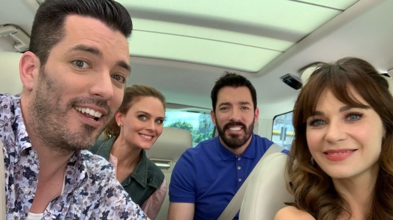 Jonathan Scott, Drew Scott, Zooey Deschanel, and Zooey Deschanel's sister take a selfie while filming "Carpool Karaoke: The Series"