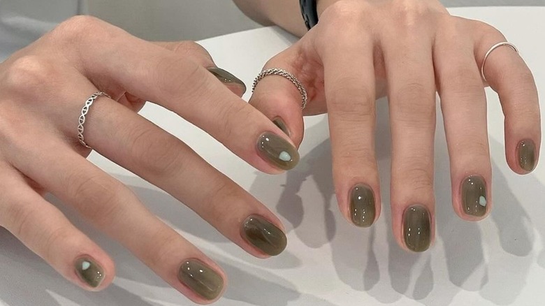 A close up of a person's nails after a manicure