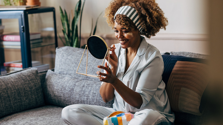 Black woman doing skincare