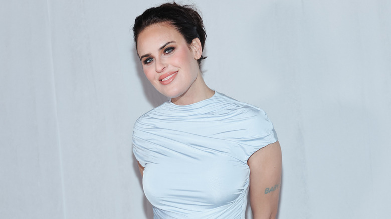 Tallulah Willis posing in a light blue dress at the premiere of 