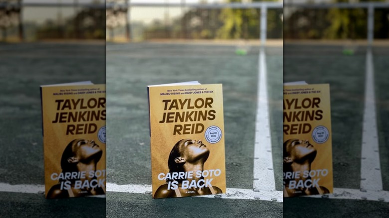 A copy of "Carrie Soto Is Back" standing up on a tennis court