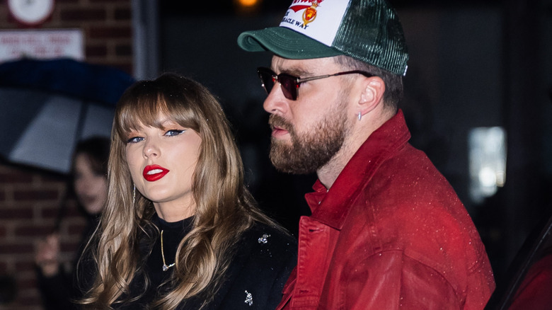 Taylor Swift and Travis Kelce walking together outside in New York City