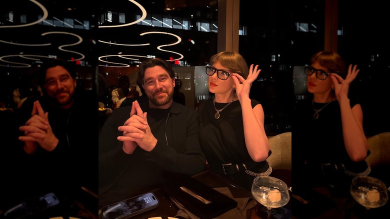 Travis Kelce and Taylor Swift posing together at a restaurant