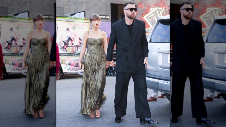 Taylor Swift holding the hand of Travis Kelce while walking across the street