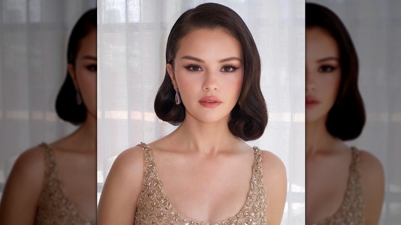 Selena Gomez wearing a gold dress and bobbed hair