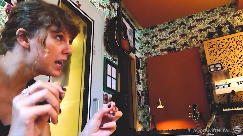 Still of Taylor Swift looking off-camera while working on the song "Getaway Car"