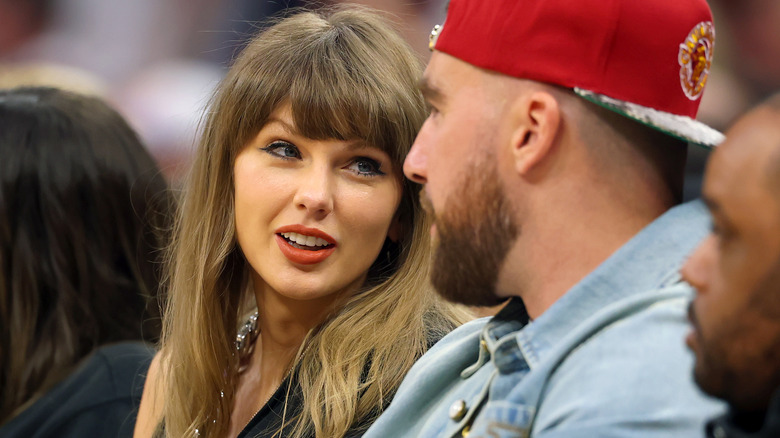 Taylor Swift looking over to Travis Kelce during a 2026 Knicks game