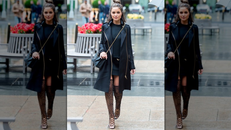 Olivia Culpo wearing thigh high boots in 2016