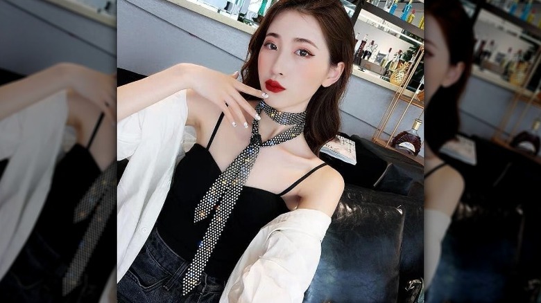 Woman in embellished tie