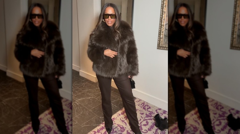 A woman in a brown faux fur coat