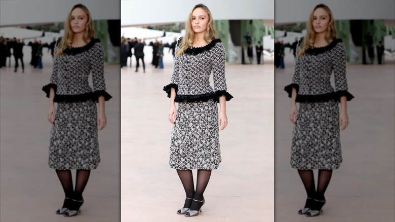 Lily Rose Depp frowns at Paris Fashion Week