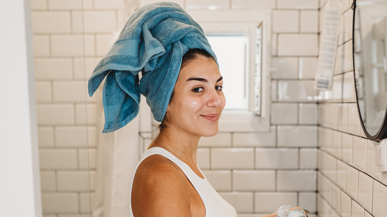 Woman putting on primer 