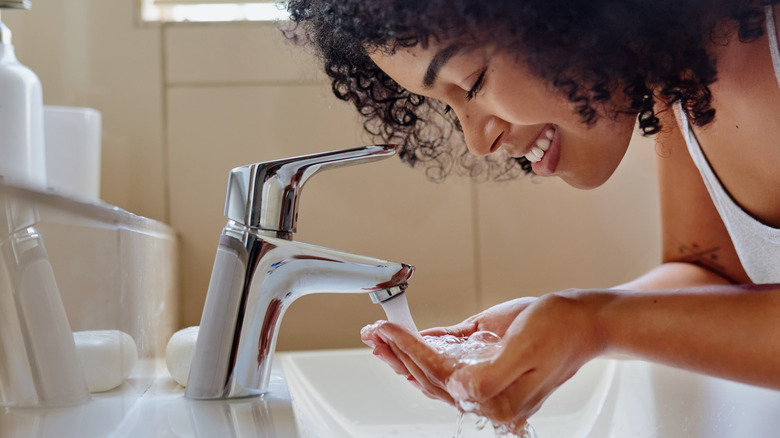 Woman washing face
