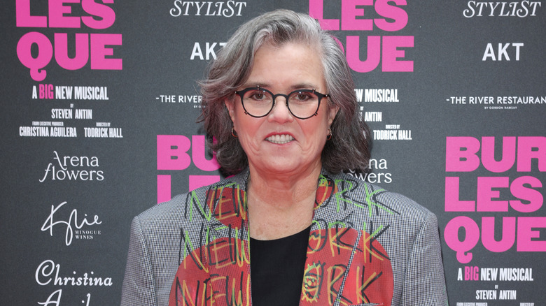 Rosie O'Donnell in a gray jacket at an event