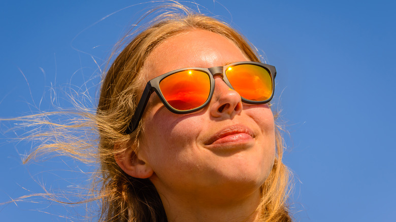 woman wearing polarized sunglasses