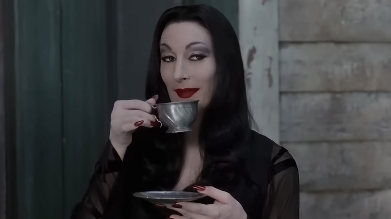 Anjelica Huston as Morticia Addams