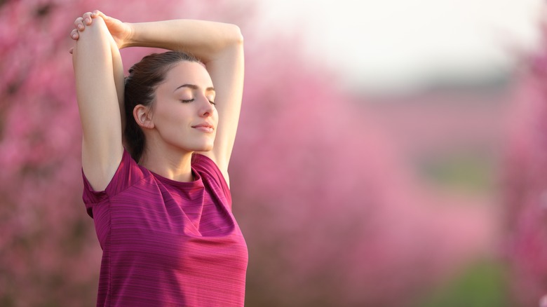woman stretching arms and relaxing