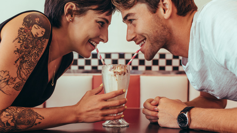 couple drinking milkshake 