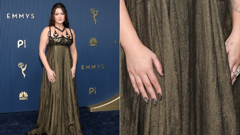 Isa Briones in a long green gown with a matte charcoal manicure