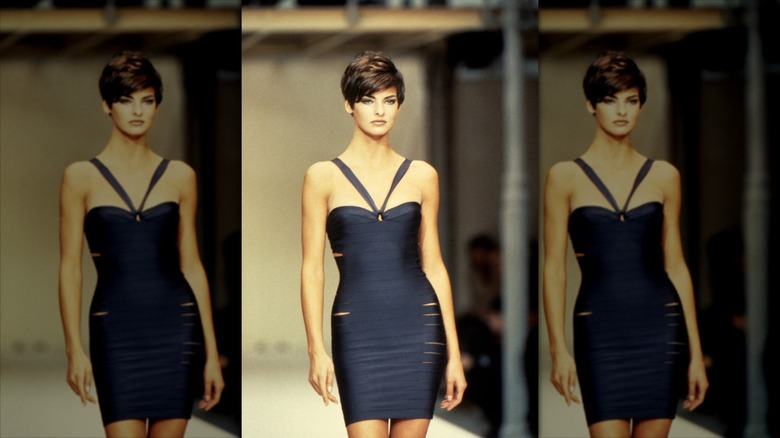 Linda Evangelista walks the catwalk with a brunette pixie cut