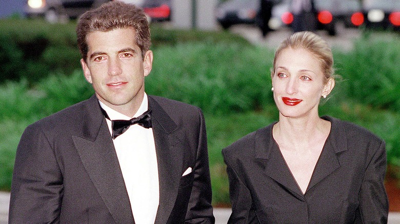 JFK Jr. holding hands with Carolyn Bessette