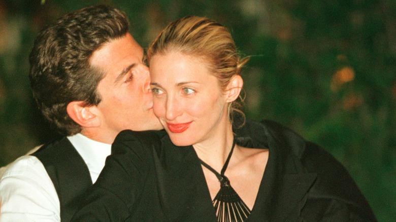 John F. Kennedy Jr. kissing Carolyn Bessette on the cheek