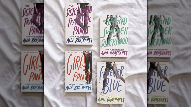 Each book from "The Sisterhood of the Traveling Pants" series laying on a bed