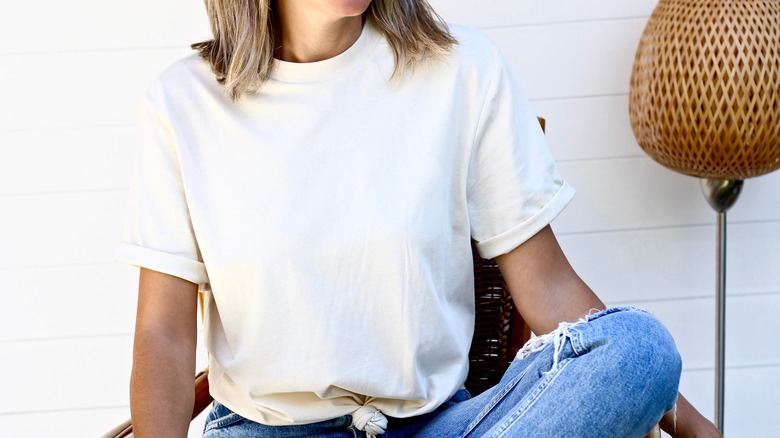 woman in white shirt and jeans