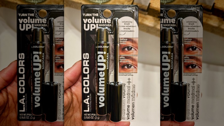 Hand holding the Turn the Volume Up Mascara from L.A. Colors, still in the package