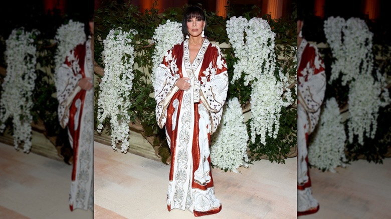 Kris Jenner posing at the 2026 Met Gala in a kimono-inspired dress