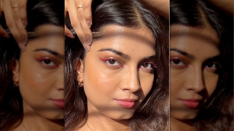A woman wearing pink eyeliner on Instagram