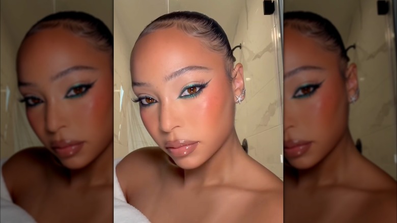 A woman with teal eyeliner on Instagram