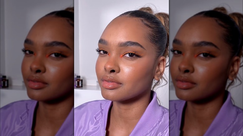 A woman wearing orange eyeliner on Instagram