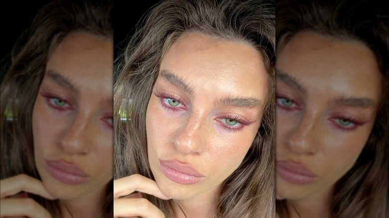 A woman wearing deep plum eyeliner on Instagram